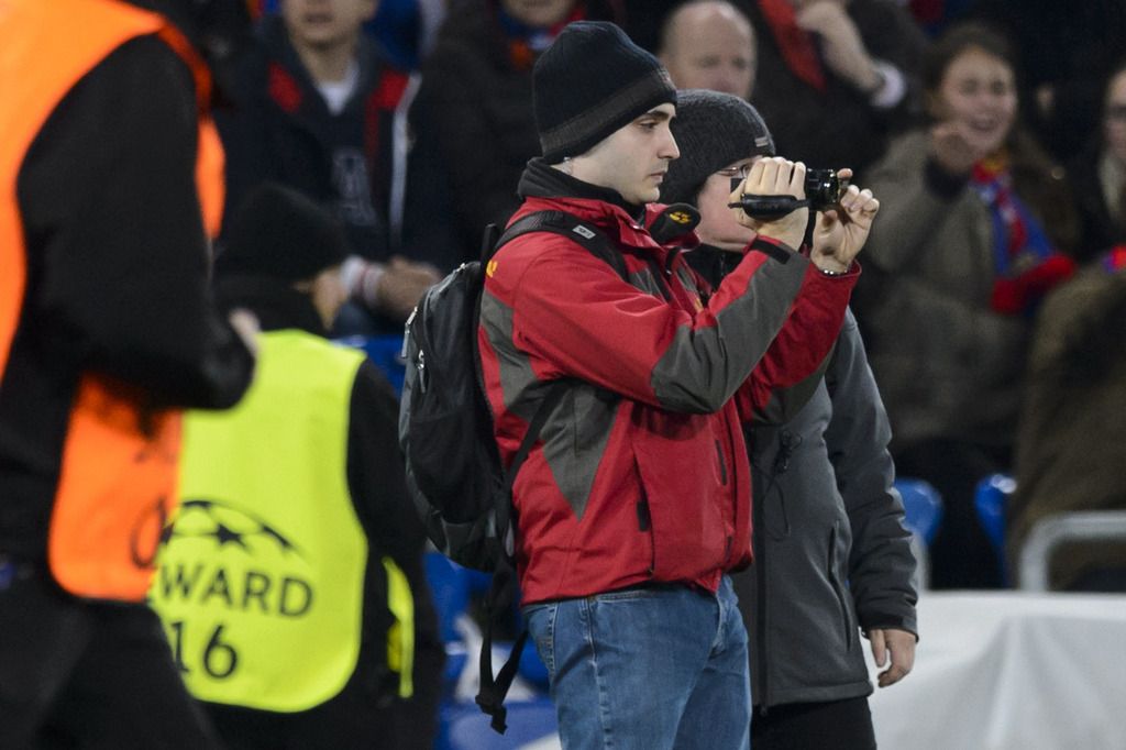 Fans film on the pitch during an UEFA Champions League group B matchday 5 soccer match between Switzerland's FC Basel 1893 and Spain's Real Madrid CF in the St. Jakob-Park stadium in Basel, Switzerland, on Wednesday, November 26, 2014. (KEYSTONE/Laurent Gillieron)