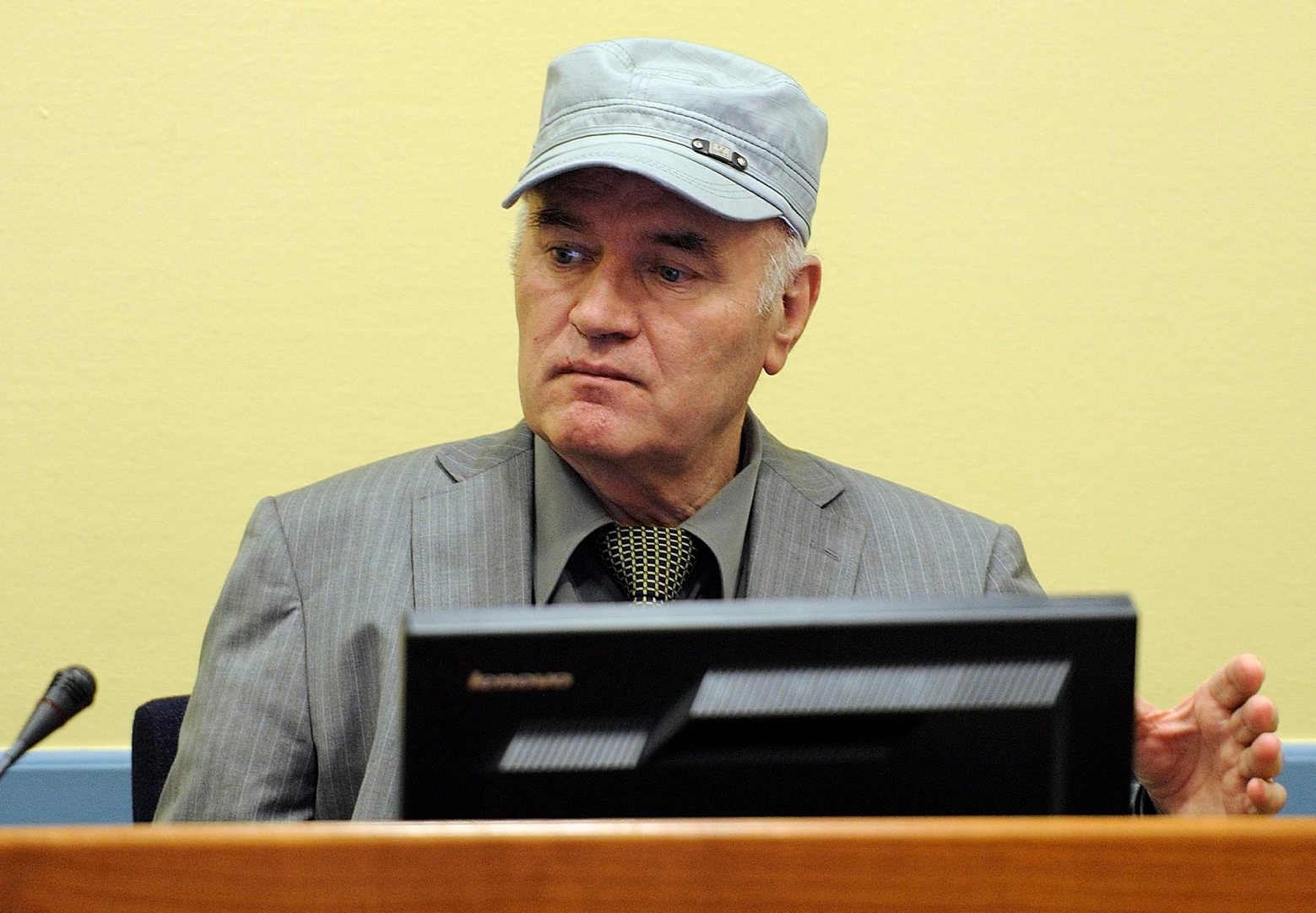 Former Bosnian Serb Gen. Ratko Mladic sits in the court room during his initial appearance at the U.N.'s Yugoslav war crimes tribunal in The Hague, Netherlands, Friday, June 3, 2011. Mladic's appearance Friday at the Yugoslav war crimes tribunal in The Hague is his first public appearance since he went into hiding nearly 16 years ago, when he was indicted for genocide and war crimes committed in the 1992-95 Bosnian war. (AP Photo/ Martin Meissner, Pool) Netherlands War Crimes Mladic
