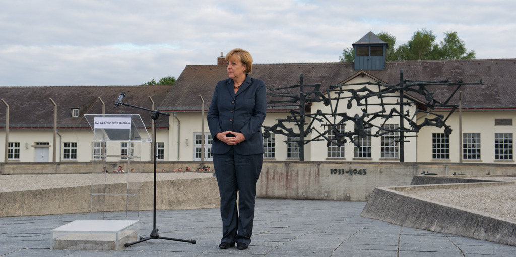 German Chancellor Angela Merkel, delivers a speech   during a visit to  the  concentration camp Dachau  where more than 43,000 persons were murdered and over 200,000 were imprisoned during the Nazis? terror reign from 1933-1945 in Dachau, southern Germany, on Tuesday,Aug.20, 2013.  She was invited by a former inmate, 93-year-old Max Mannheimer, who was liberated from Dachau by American soldiers in 1945.   Merkels? visit Tuesday evening was the first by a German chancellor to Dachau. (AP Photo/ dpa,  Inga Kjer)