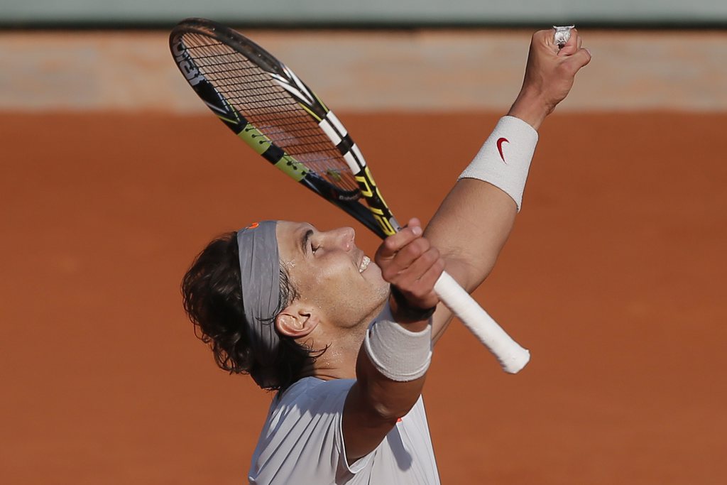 Spain's Rafael Nadal celebrates winning against Italy's Fabio Fognini in their third round match at the French Open tennis tournament, at Roland Garros stadium in Paris, Saturday, June 1, 2013. Nadal won in three sets 7-6, 6-4, 6-4. (AP Photo/Michel Spingler)