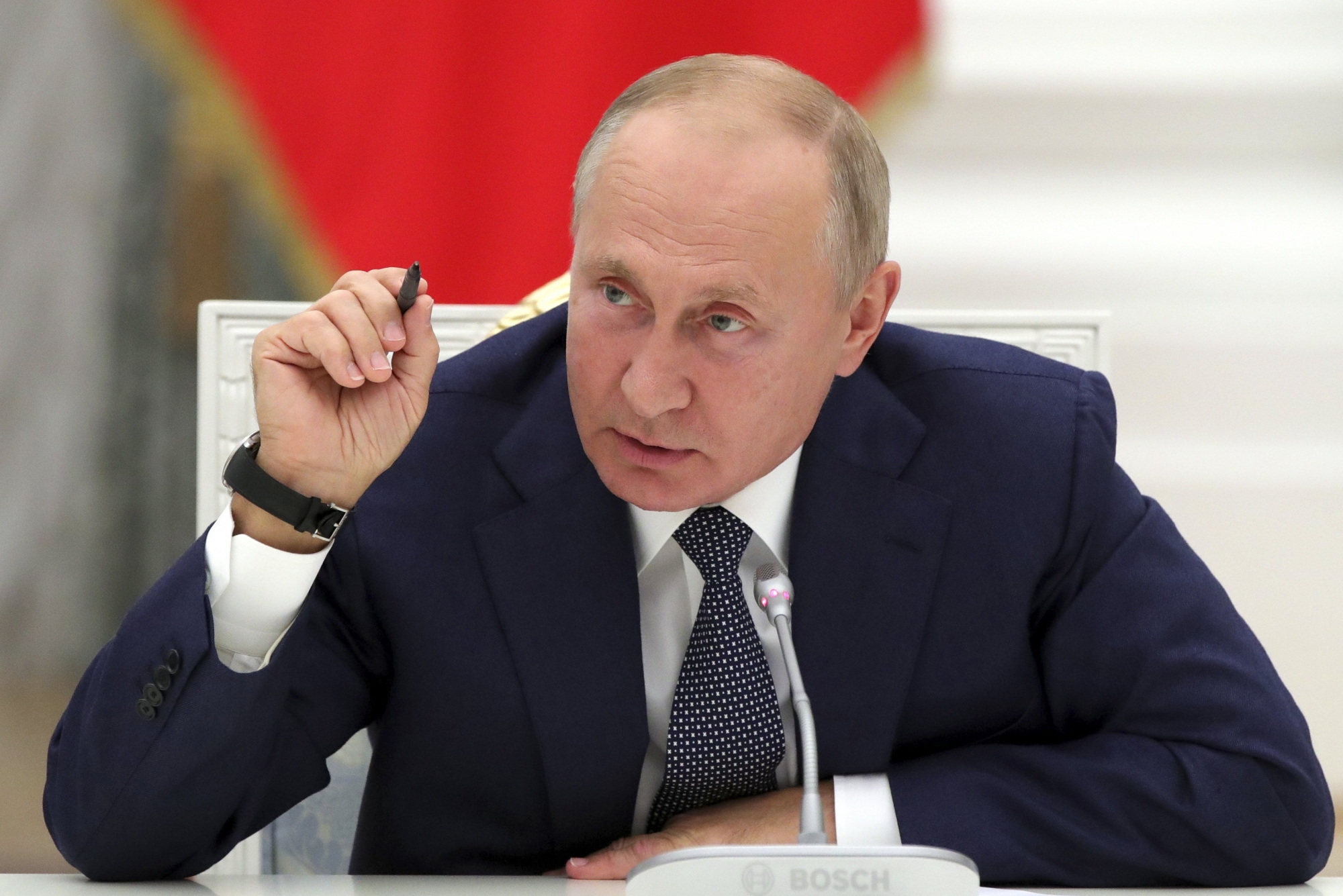 Russian President Vladimir Putin gestures while speaking during a meeting with employees of the nuclear industry on their professional holiday, Nuclear Industry Worker's Day, at the Kremlin in Moscow, Russia, Wednesday, Sept. 23, 2020. (Mikhail Metzel, Sputnik, Kremlin Pool Photo via AP) ArcInfo