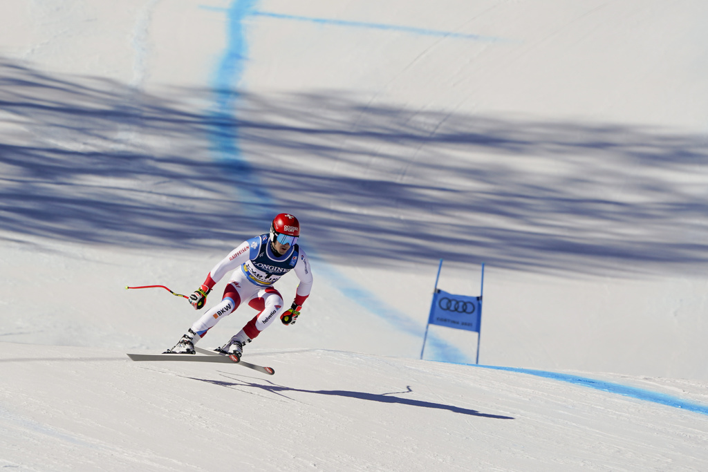 Switzerland's Loic Meillard speeds down the course during the super G portion of the men's combined race, at the alpine ski World Championships, in Cortina d'Ampezzo, Italy, Monday, Feb. 15, 2021. (AP Photo/Giovanni Auletta)