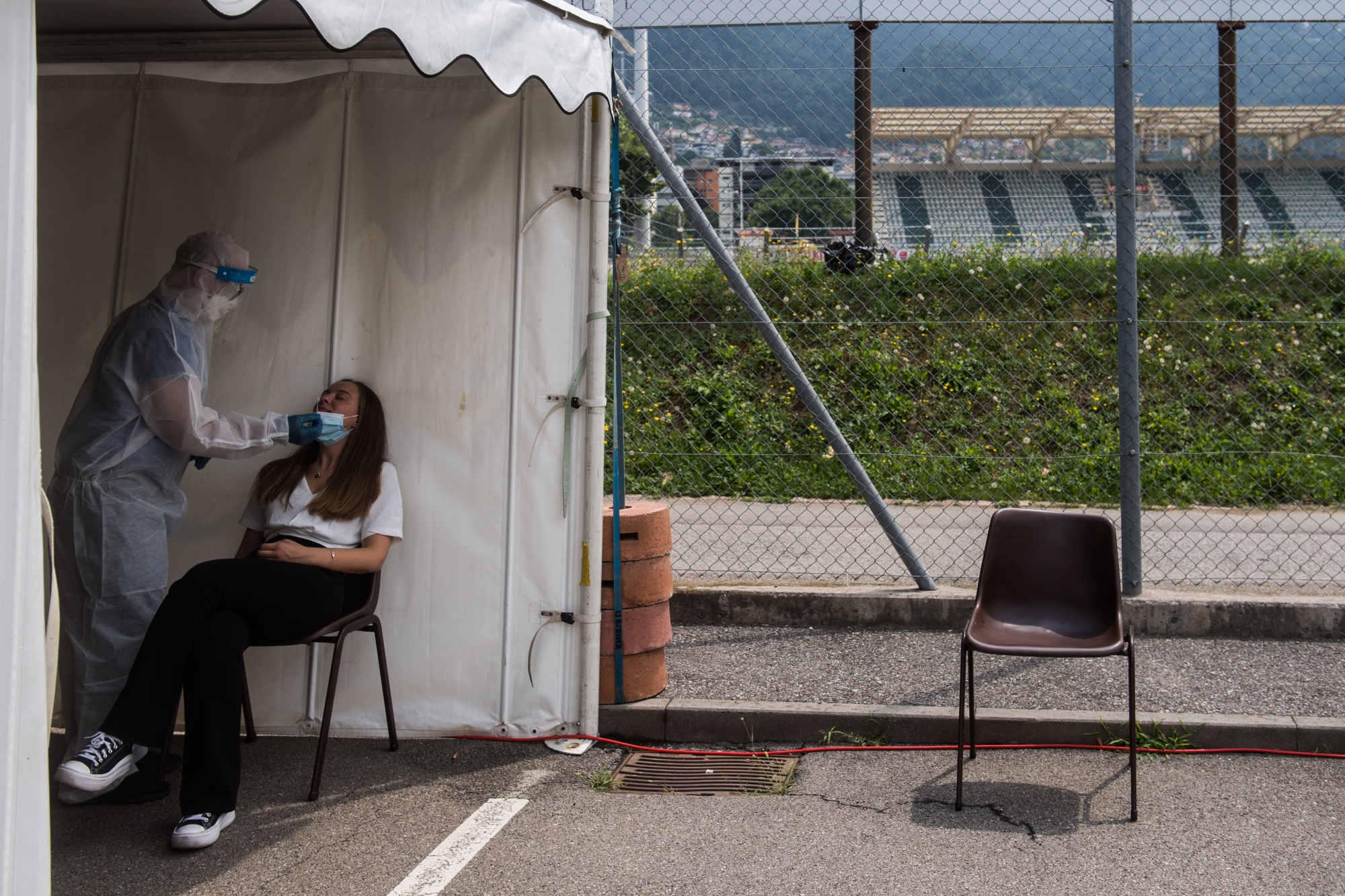 A spectator is tested for the coronavirus before the Super League soccer match FC Lugano against FC Zuerich, at the Cornaredo stadium in Lugano, on Sunday, 25 July, 2021. (KEYSTONE/Ti-Press/Samuel Golay)