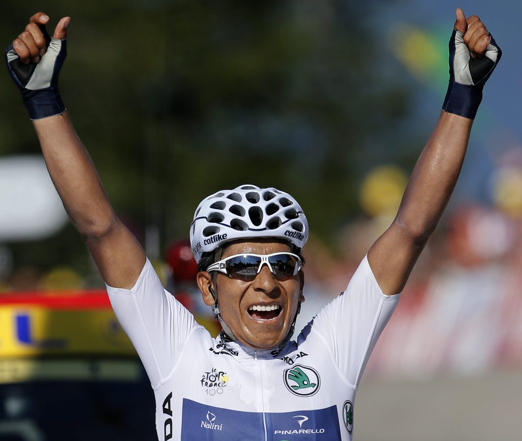 Nairo Alexander Quintana of Colombia, wearing the best young rider's white jersey, crosses the finish line to win the 20th stage of the Tour de France cycling race over 125 kilometers (78.1 miles) with start in in Annecy and finish in Annecy-Semnoz, France, Saturday July 20 2013. (AP Photo/Laurent Rebours)