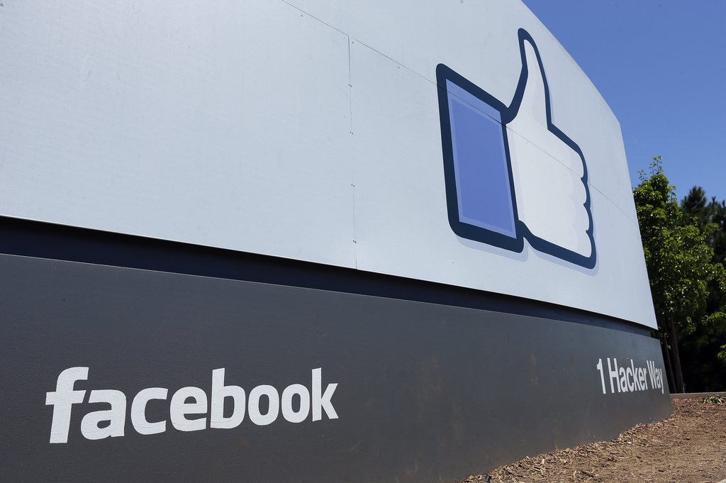 This Tuesday, July 16, 2013, photo, shows a sign seen at Facebook headquarters in Menlo Park, Calif. Facebook reports quarterly earnings on Wednesday, July 24, 2013. (AP Photo/Ben Margot)