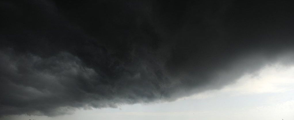 A boat in Assateague Channel is dwarfed by a thunderstorm cloud just before the Chincoteague Ponies hit the water for their annual swim to Chincoteague, Va. on Wednesday, July 24, 2013. The storm brought heavy rain as the ponies made the 88th annual swim. (AP Photo/Jay Diem, Eastern Shroe News) NO SALES