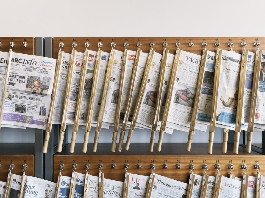 Newspapers on newspaper holders at the University of St. Gallen HSG in St. Gallen, Switzerland, on March 27, 2018. (KEYSTONE/Christian Beutler)