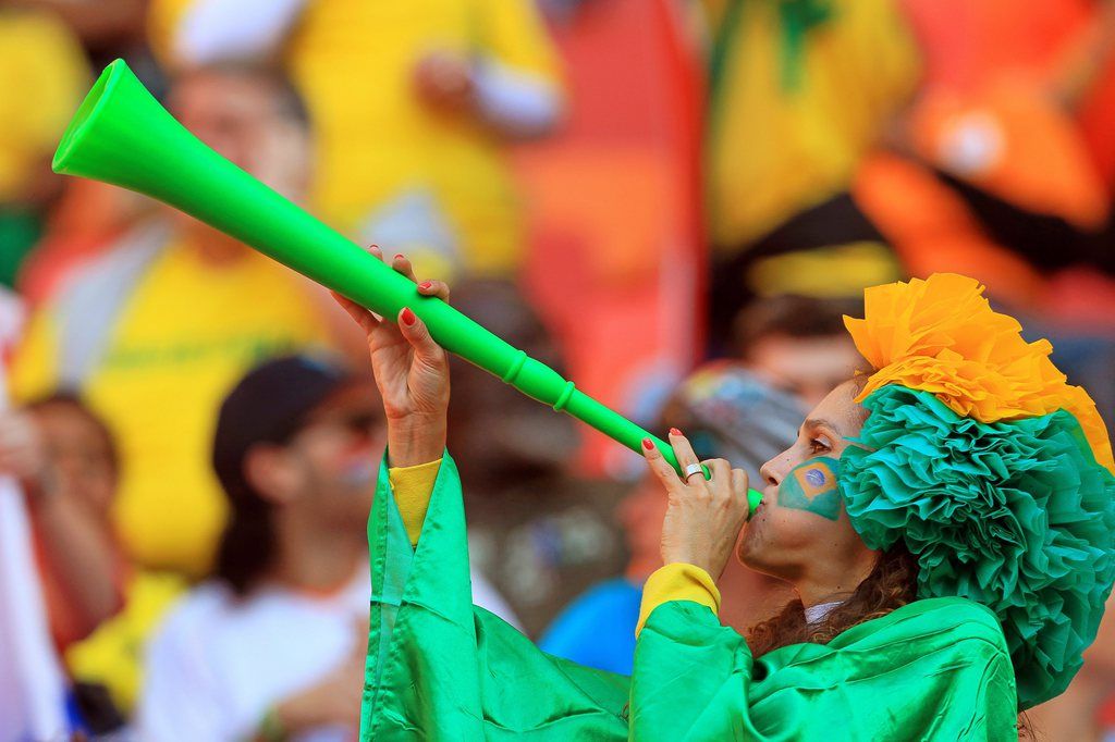 epa02233379 A Brazilian soccer fan blows a Vuvuzela horn before the FIFA World Cup 2010 quarter final soccer match between the Netherlands and Brazil at the Nelson Mandela Bay stadium in Port Elizabeth, South Africa, 02 July 2010.  EPA/ROBERT GHEMENT Please refer to www.epa.eu/downloads/FIFA-WorldCup2010-Terms-and-Conditions.pdf