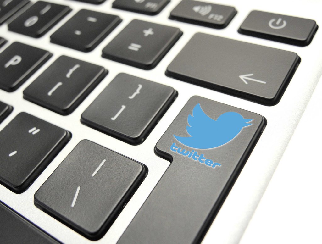 epa03939667 An illustration image of a Twitter logo on a keyboard, pictured in The Hague, The Netherlands, 07 November 2013. Twitter will make its Wall Street debut on 07 November with a price tag of 26 US dollars per share, bidding to raise up to 2.1 billion US dollars in the most eagerly awaited stock offering since Facebook. A tweet from the company said it would offer 70 million shares on the New York Stock Exchange, generating 1.82 billion US dollars, and give underwriters a 30-day option to purchase an additional 10.5 million shares of common stock.  EPA/LEX VAN LIESHOUT