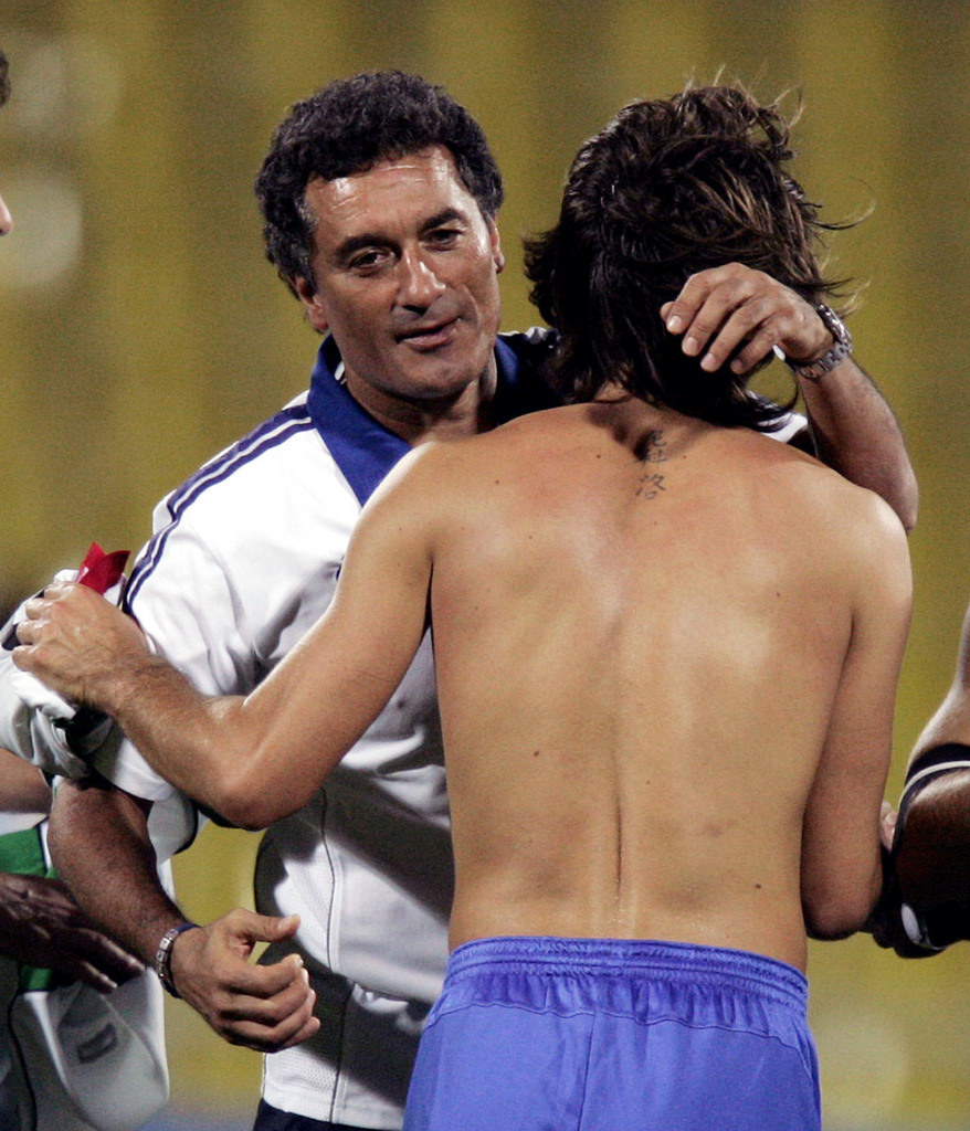 Italy's coach Claudio Gentile, left, embraces team captain Andrea Pirlo at the end of a bronze medal men soccer game for the Athens 2004 Olympics between Italy and Iraq at the Kaftanzoglio stadium in the north port city of Thessaloniki, Greece, on Friday, Aug. 27, 2004. Italy won 1-0. (KEYSTONE/AP Photo/Luca Bruno)