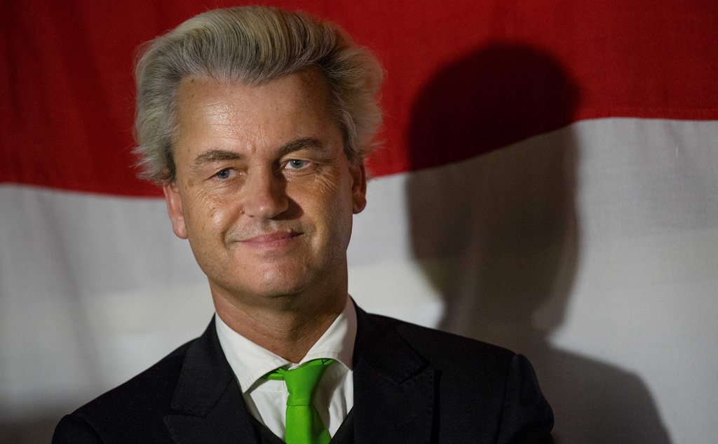 epa04219920 Dutch right-wing 'Partij voor de Vrijheid' (PVV) leader Geert Wilders on stage in a bar in Scheveningen, The Netherlands, 22 May 2014, reacts to the exit polls after the European elections held in The Netherlands on 22 May.  EPA/Bart Maat