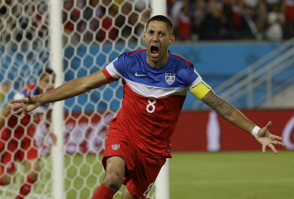 United States' Clint Dempsey celebrates after scoring the opening goal during the group G World Cup soccer match between Ghana and the United States at the Arena das Dunas in Natal, Brazil, Monday, June 16, 2014. The United States won the match 2-1. (AP Photo/Ricardo Mazalan)
