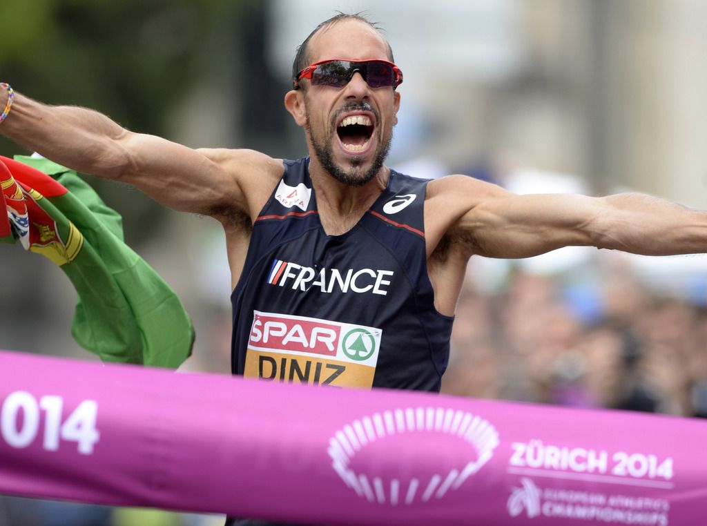 Winner Yohann Diniz from France crosses the finish line after the men's 50km race walking in the city centre of Zurich at the fourth day of the European Athletics Championships in Zurich, Switzerland, Friday, August 15, 2014. (KEYSTONE/Walter Bieri)