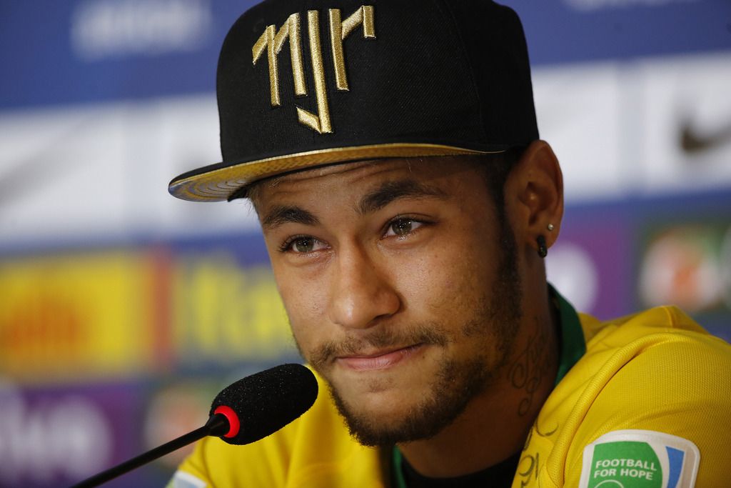 Brazil's Neymar talks to the media a press conference at the Granja Comary training center in Teresopolis, Brazil, Thursday, July 10, 2014. The Brazilian soccer star is back on his feet after suffering a broken vertebrae during a World Cup soccer match against Colombia. Brazil will be disputing a third place finish, without its star on Saturday. (AP Photo/Leo Correa)