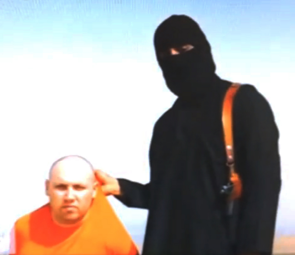 This still image from an undated video released by Islamic State militants on Tuesday, Aug. 19, 2014, purports to show journalist Steven Sotloff being held by the militant group. The Islamic State group has threatened to kill Sotloff if the United States doesn't stop its strikes against them in Iraq. Sotloff's mother, Shirley Sotloff, pleaded for his release Wednesday, Aug. 27, 2014, in a video message aimed directly at his captors that aired on the Al-Arabiya television network. (AP Photo)