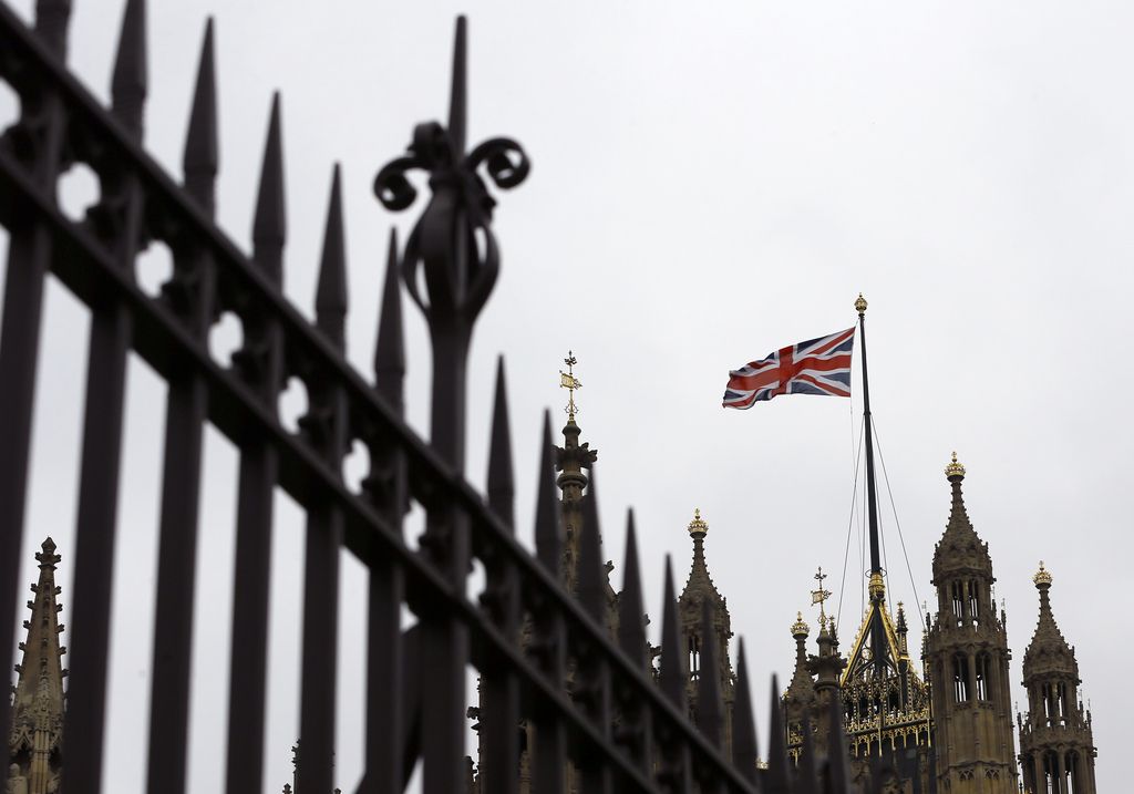 The Union flag flies above Parliament in London, Friday, Sept. 26, 2014. Britain's Parliament is to debate and vote on the UK response to Iraqi's government's request for support against the Islamic State group. A result to the vote is expected late Friday. (AP Photo/Kirsty Wigglesworth)