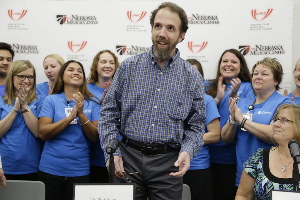 Former Ebola patient Dr. Richard Sacra arrives to a news conference at the Nebraska Medical Center in Omaha, Neb., Thursday, Sept. 25, 2014. Sacra, who was treated at the medical center the last three weeks, has left his room in the biocontainment unit and will head home soon. The Centers for Disease Control and Prevention confirmed that two separate blood samples taken from Sacra 24 hours apart show the Ebola virus is no longer in his bloodstream. (AP Photo/Nati Harnik)