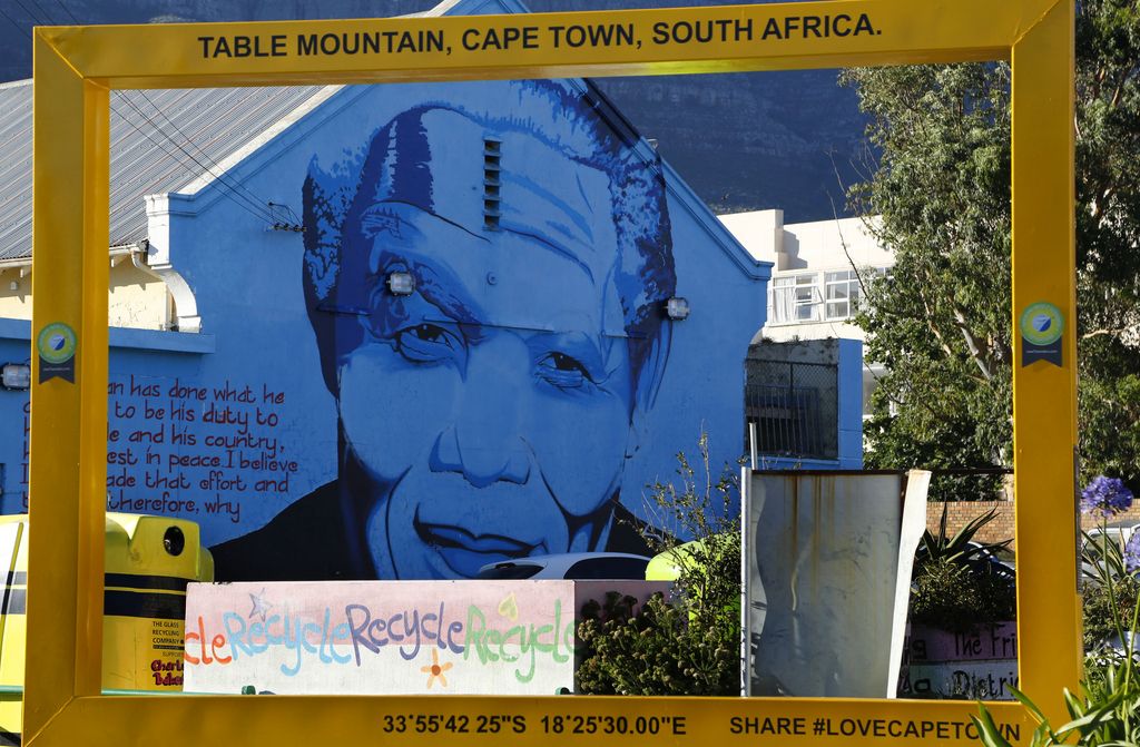 A mural of former South African President Nelson Mandela is painted on the wall of a building during his first dead anniversary in Cape Town, South Africa, Friday, Dec. 5, 2014. Mandela died on Dec. 5 last year at the age of 95 after a long illness. (AP Photo/Schalk van Zuydam)