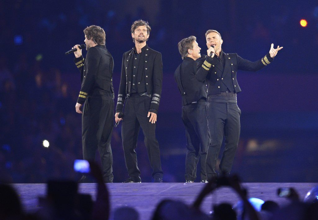 epa04416326 (FILE) The file picture dated 12 August 2012 shows the members of British band Take That (L-R) Howard Donald, Jason Orange, Mark Owen and Gary Barlow performing during the Closing Ceremony of the London 2012 Olympic Games, London, Britain. According to a statement by members of Take That on 24 September 2014, the band will continue without Jason Orange, who decided to leave the group.  EPA/CHRISTOPHE KARABA *** Local Caption *** 50484371