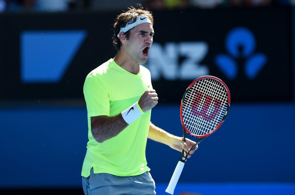 epa04572399 Roger Federer of Switzerland celebrates a point as he plays Simone Bolelli of Italy during the Australian Open Grand Slam tennis tournament at Melbourne Park in Melbourne, Australia, 21 January 2015. The Australian Open tennis tournament runs from the 19 January to 01 February 2015.  EPA/LUKAS COCH AUSTRALIA AND NEW ZEALAND OUT