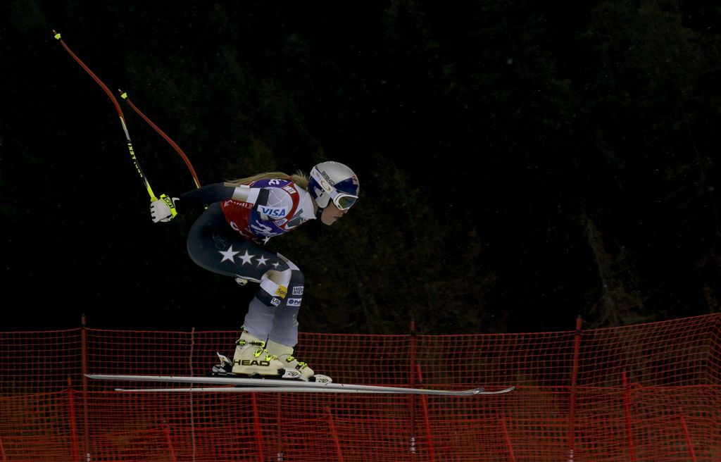 United States Lindsey Vonn speeds down the course during an alpine ski, women's World Cup downhill race, in Cortina d'Ampezzo, Italy, Friday, Jan. 16, 2015. Vonn finished 10th. (AP Photo/Domenico Stinellis)