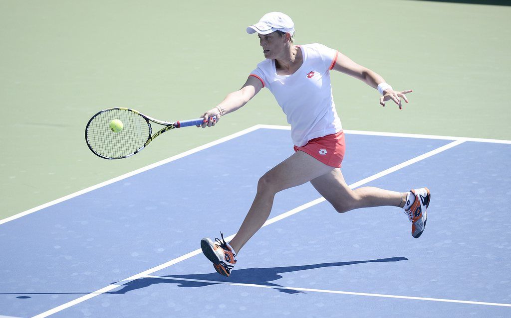 epa04368136 Romina Oprandi of Switzerland hits a return to Daniela Hantuchova of Slovankia during the 2014 US Open Tennis Championship at the USTA National Tennis Center in Flushing, Meadows, New York, USA, 25 August 2014. The US Open runs through Monday 08 September, a 15-day schedule.  EPA/JOHN G. MABANGLO
