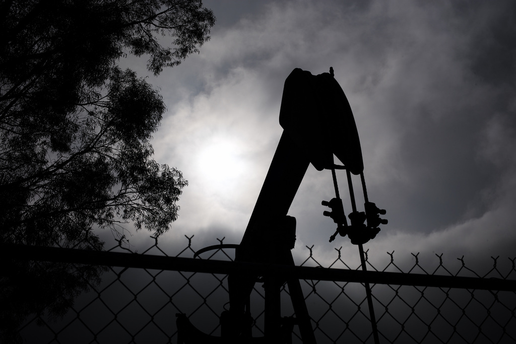 A pumpjack operates next to Tony Lemon's home, Thursday, Jan. 15, 2015, in Bakersfield, Calif. Lemon and other neighbors living around the idled well said they had been told nothing of any threat to local water. But Lemon said he trusted oil companies to safeguard the public water supply. ?As long as they know what they?re doing, taking care of business,? Lemon said. (AP Photo/Jae C. Hong)