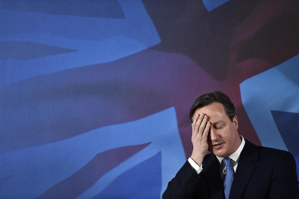 Britain's Prime Minister David Cameron gestures, as he makes a speech, during a General Election campaign visit to Croydon, in Surrey, England, Saturday April 25, 2015.  Britain goes to the polls in a general election on May 7. (Toby Melville, Pool Photo via AP)