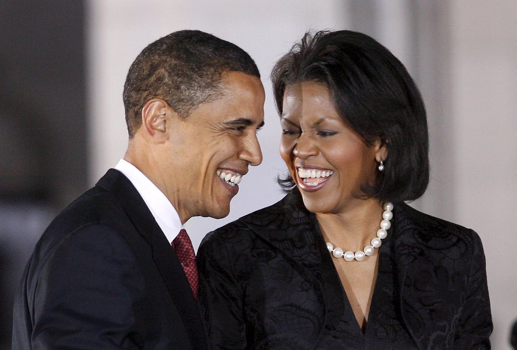 epa01275638 Illinois Senator and Democratic Presidential hopeful Barack Obama (L) and his wife Michelle Obama (R) share a laugh before addressing the crowd at a post-primary rally at the Municipal Auditorium in San Antonio, Texas, USA, 04 March 2008. Obama scored an easy win in Vermont, the first of four states to wrap up its voting on Tuesday, but is projected to lose Ohio.  EPA/AARON M. SPRECHER