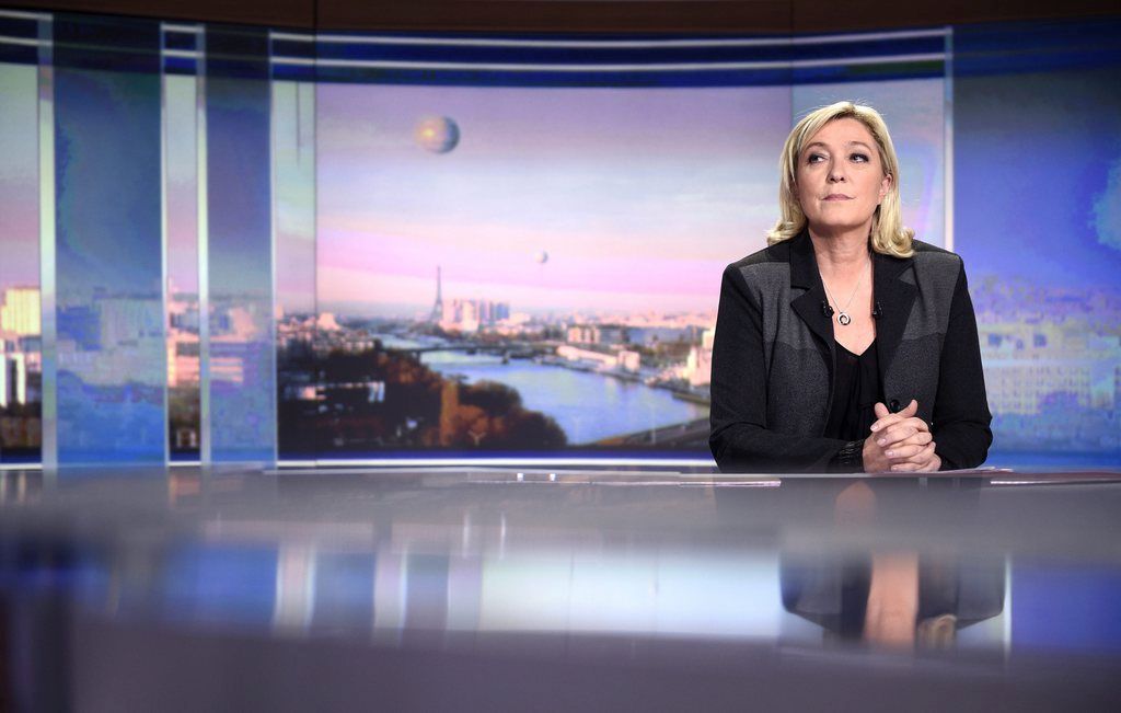 epa04697629 French Front National leader Marine Le Pen prior to speaking during a French TV channel TF1 evening news program, in Boulogne-Billancourt near Paris, France, 09 April 2015. France's far-right was plunged into disarray as National Front leader Marine Le Pen openly split with party founder and her father Jean-Marie Le Pen after gas chamber comments she described as 'political suicide'.  EPA/MARTIN BUREAU / POOL