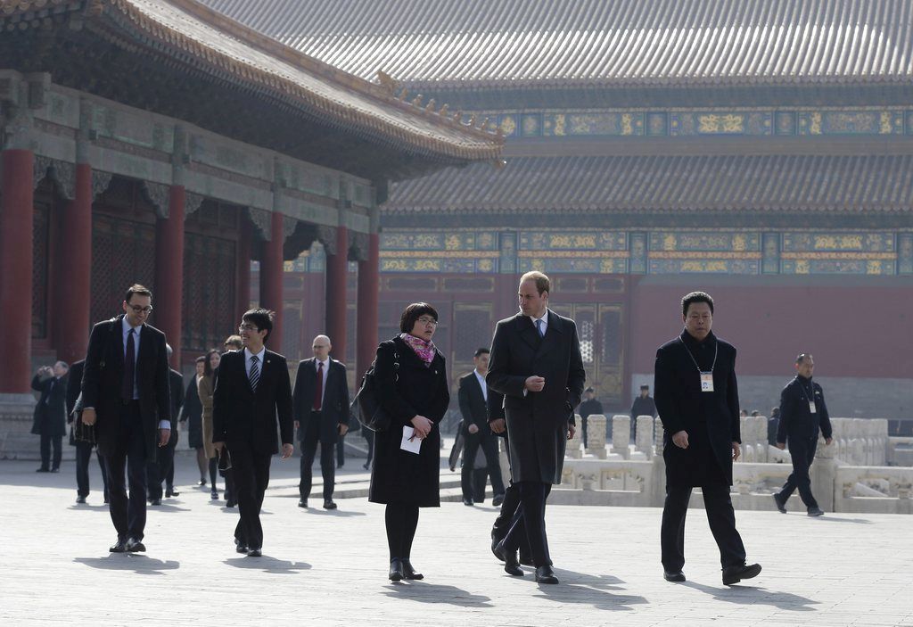 epa04643994 Britain's Prince William (2-R, front), Duke of Cambridge is guided by Chinese officials as he tours the Forbidden City during his first visit in Beijing, China, 02 March 2015. Prince William is in China on a four-day visit.  EPA/ANDY WONG/POOL