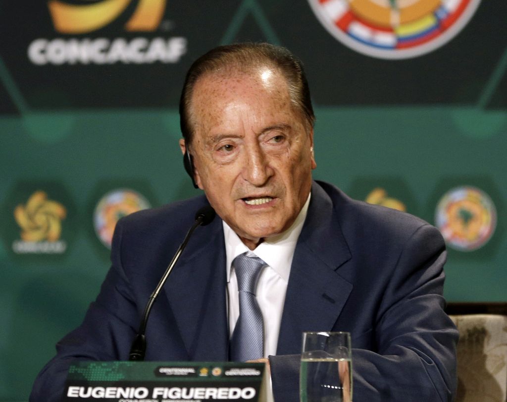 In this May 1, 2014 photo Eugenio Figueredo, president of CONMEBOL, the South America soccer confederation, speaks during a news conference in Bal Harbour, Fla.. Figueredo is among seven soccer officials that were arrested and detained by Swiss police on Wednesday, May 27, 2015, at the request of U.S. authorities after a raid at Baur au Lac Hotel in Zurich. (AP Photo/Alan Diaz)