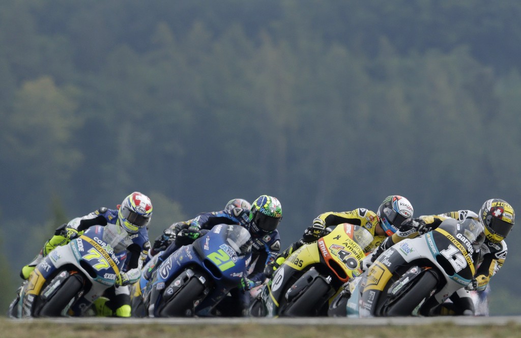 Kalex rider Thomas Luethi, right, from Switzerland leads a pack of riders during the Moto2 race at the Motorcycle Grand Prix of the Czech Republic at the Masaryk circuit in Brno, Czech Republic, Sunday, Aug. 16, 2015. (AP Photo/Petr David Josek)