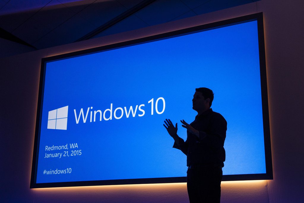 epa04575678 Handout image released by Microsoft showing Microsoft Executive Vice President of Operating Systems Terry Myerson speaking during a Windows 10 press conference in Redmond, Washington, USA, 21 January 2015. Windows 10 will be offered as a free and perpetual upgrade within a year from Windows 7, 8.1 and Phone 8.1, a next-generation browser code-named 'Project Spartan', universal office and other apps and an Xbox app bringing gaming on Xbox Live to PCs.  EPA/MICROSOFT / HANDOUT  HANDOUT EDITORIAL USE ONLY/NO SALES