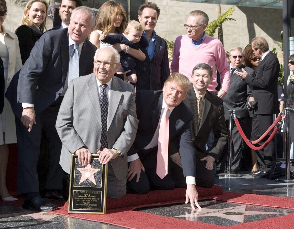 American business executive, entrepreneur and author Donald Trump (C), the producer of NBC's The Apprentice, poses after he was honored by the 2,327th star on the Hollywood Walk of Fame on Hollywood Boulevard in Hollywood, Tuesday, 16 January 2007.  EPA/ARMANDO ARORIZO