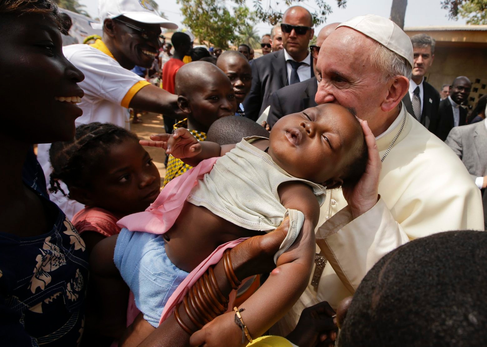 Pope Francis caresses a baby as he visits a refugee camp, in Bangui, Central African Republic, Sunday, Nov. 29, 2015. The Pope has landed in the capital of Central African Republic, his final stop in Africa and where he will seek to heal a country wracked by conflict between Muslims and Christians. (AP Photo/Andrew Medichini) Africa Pope Central African Republic