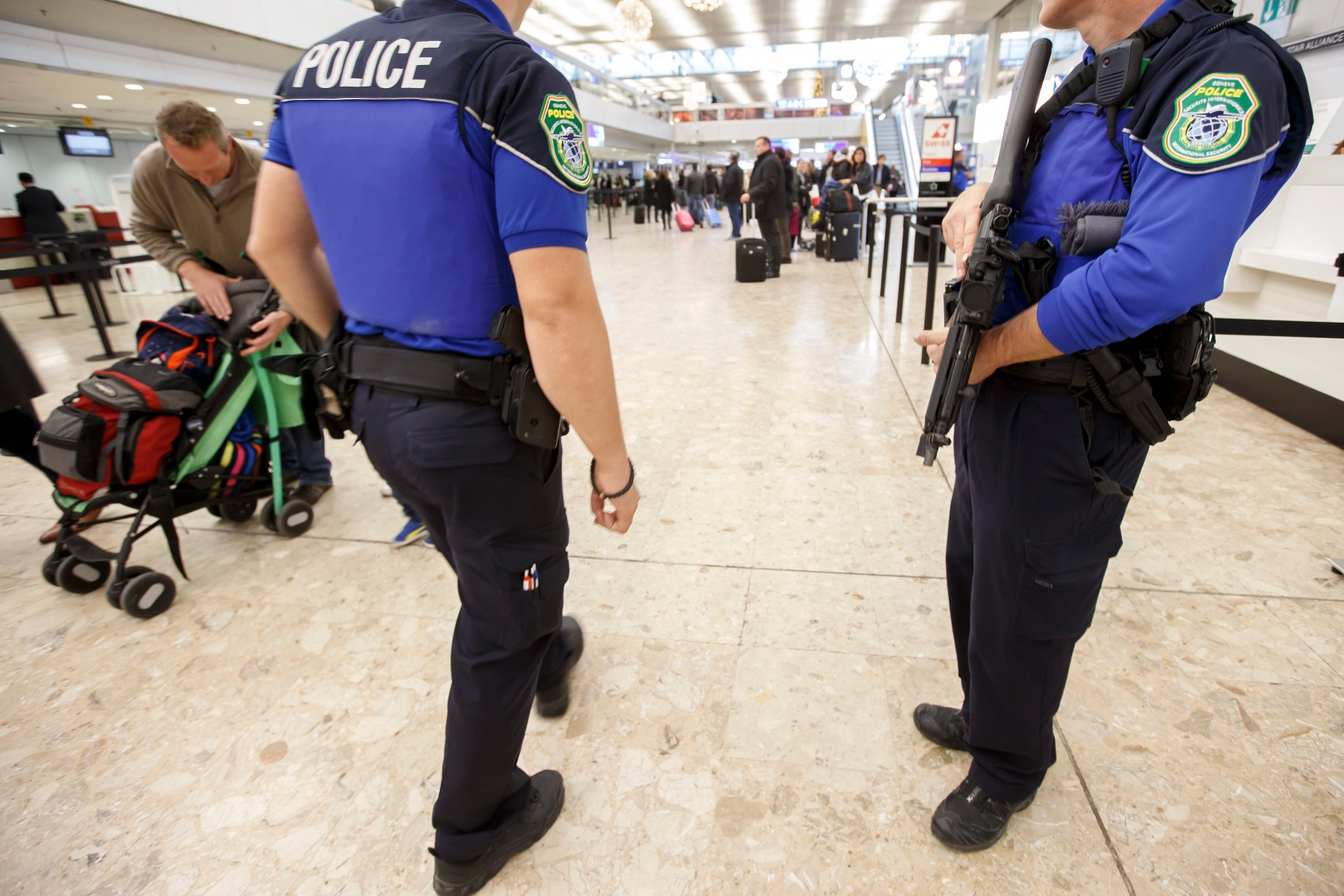 Swiss police officers patrol at the Geneva airport, during a high level of alert, in Geneva, Switzerland, Thursday, December 10, 2015. Police in Switzerland are hunting for four terror suspects, according to reports. Police believe the men are linked to the Paris attacks of November. According to local media a first suspect has been arrested. (KEYSTONE/Salvatore Di Nolfi) SWITZERLAND LEVEL VIGILANCE ATTACK