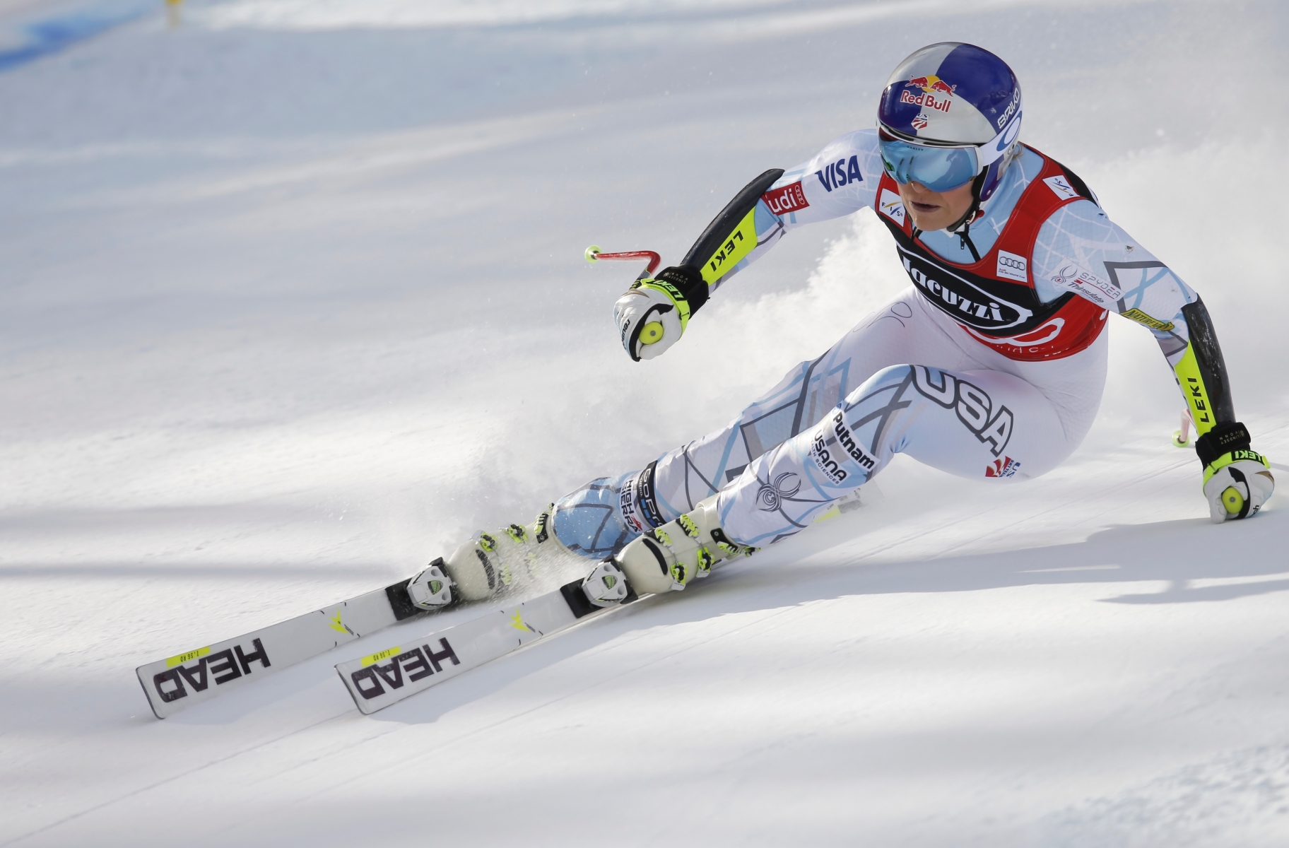 Lindsey Vonn, of the United States, speeds down the course during an alpine ski, women's World Cup super-G, in Cortina D'Ampezzo, Italy, Sunday, Jan. 24, 2016. (AP Photo/Marco Trovati) Italy Alpine Skiing World Cup