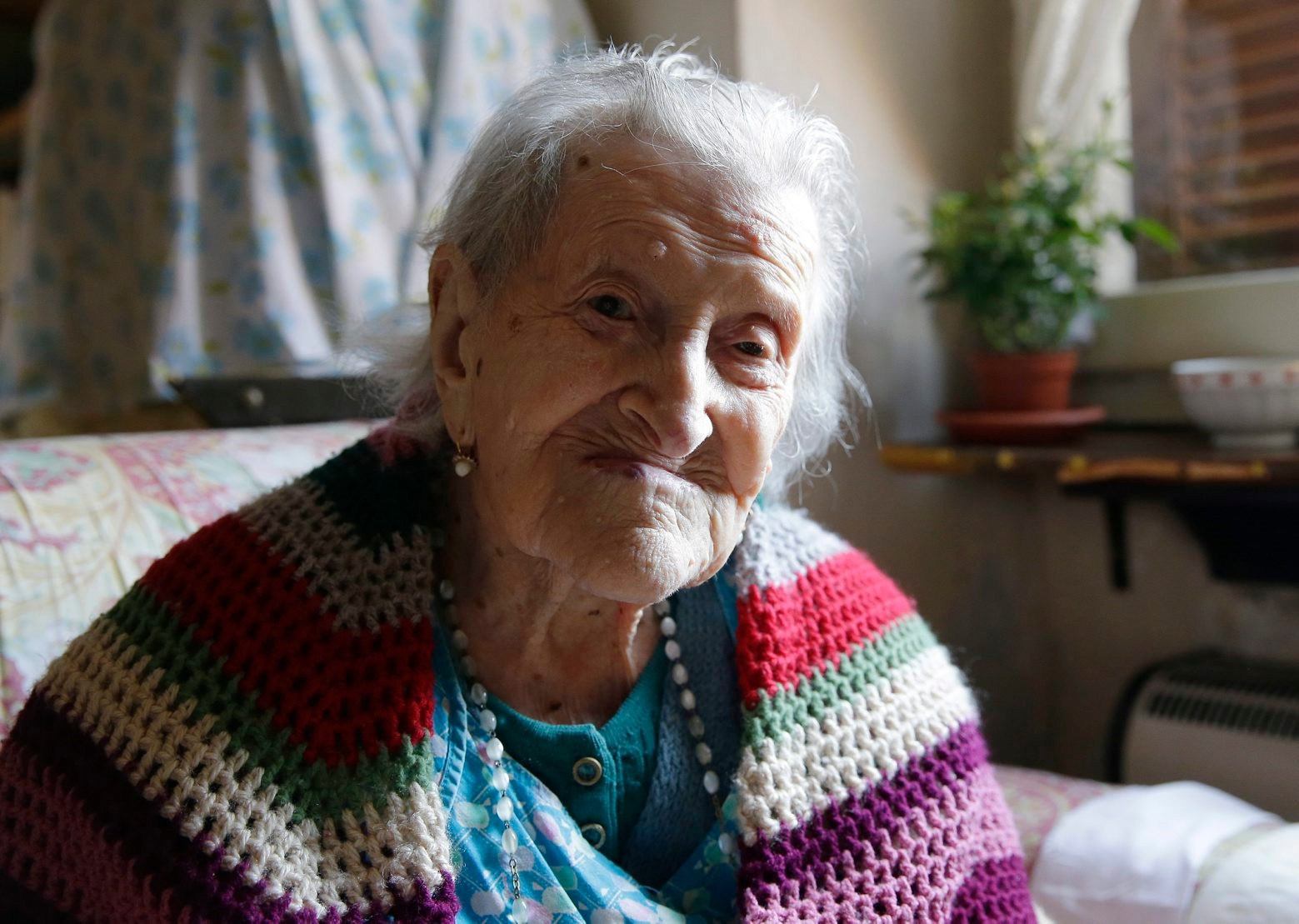 FILE - In this Friday, June 26, 2015 photo, Emma Morano, 115, sits in her apartment in Verbania, Italy. At 115 years of age, Emma is now the oldest person in the world and is believed to be the last surviving person in the world who was born in the 1800s, coming into the world on Nov. 29, 1899. Thatís just 4 and a half months after Susannah Mushatt Jones, who died Thursday in New York at the age of 116. (AP Photo/Antonio Calanni, File) Italy World's Oldest Person