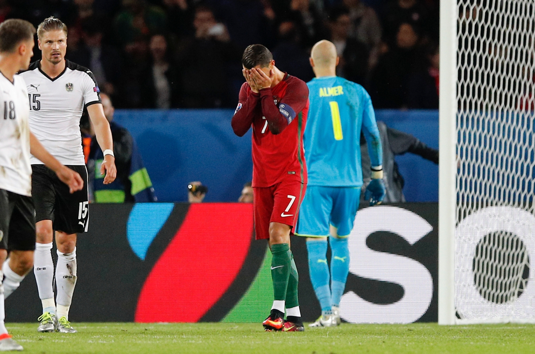 Portugal's Cristiano Ronaldo, center, holds his face after missing a penalty kick, during the Euro 2016 Group F soccer match between Portugal and Austria at the Parc des Princes stadium in Paris, France, Saturday, June 18, 2016. (AP Photo/Christophe Ena) APTOPIX Soccer Euro 2016 Portugal Austria
