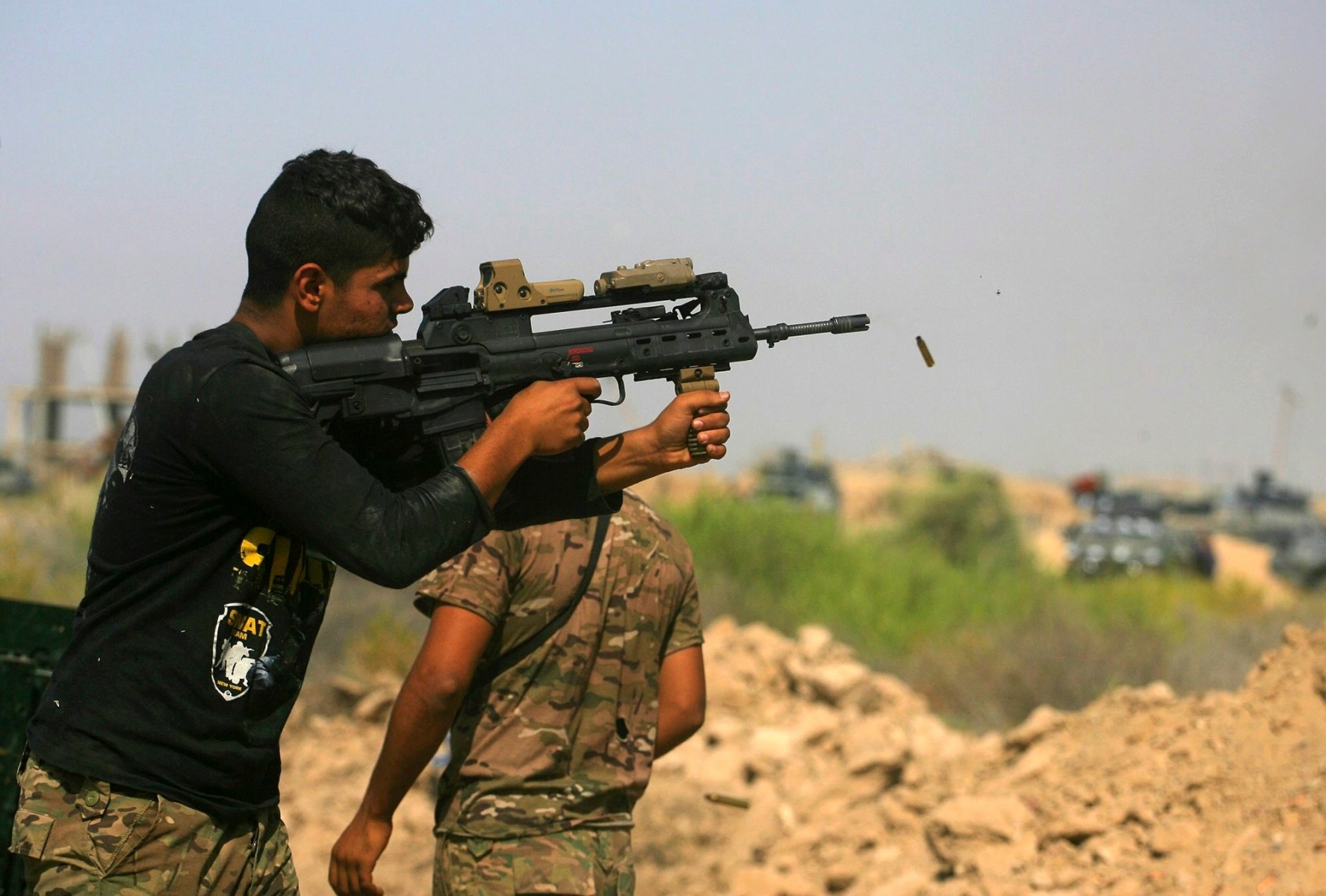 Iraqi security forces fight against Islamic State group militants in Fallujah, Iraq, Wednesday, June 15, 2016. Fallujah has been locked in a cycle of conflict since 2003, when it emerged as a bastion of the insurgency against the Americans. Militant attacks and bombings were followed by sweeping arrest raids, which further stoked local grievances. In 2004, U.S. troops launched two massive assaults on the city, where they fought their bloodiest battles since Vietnam. (AP Photo/Anmar Khalil) Mideast Iraq Islamic State