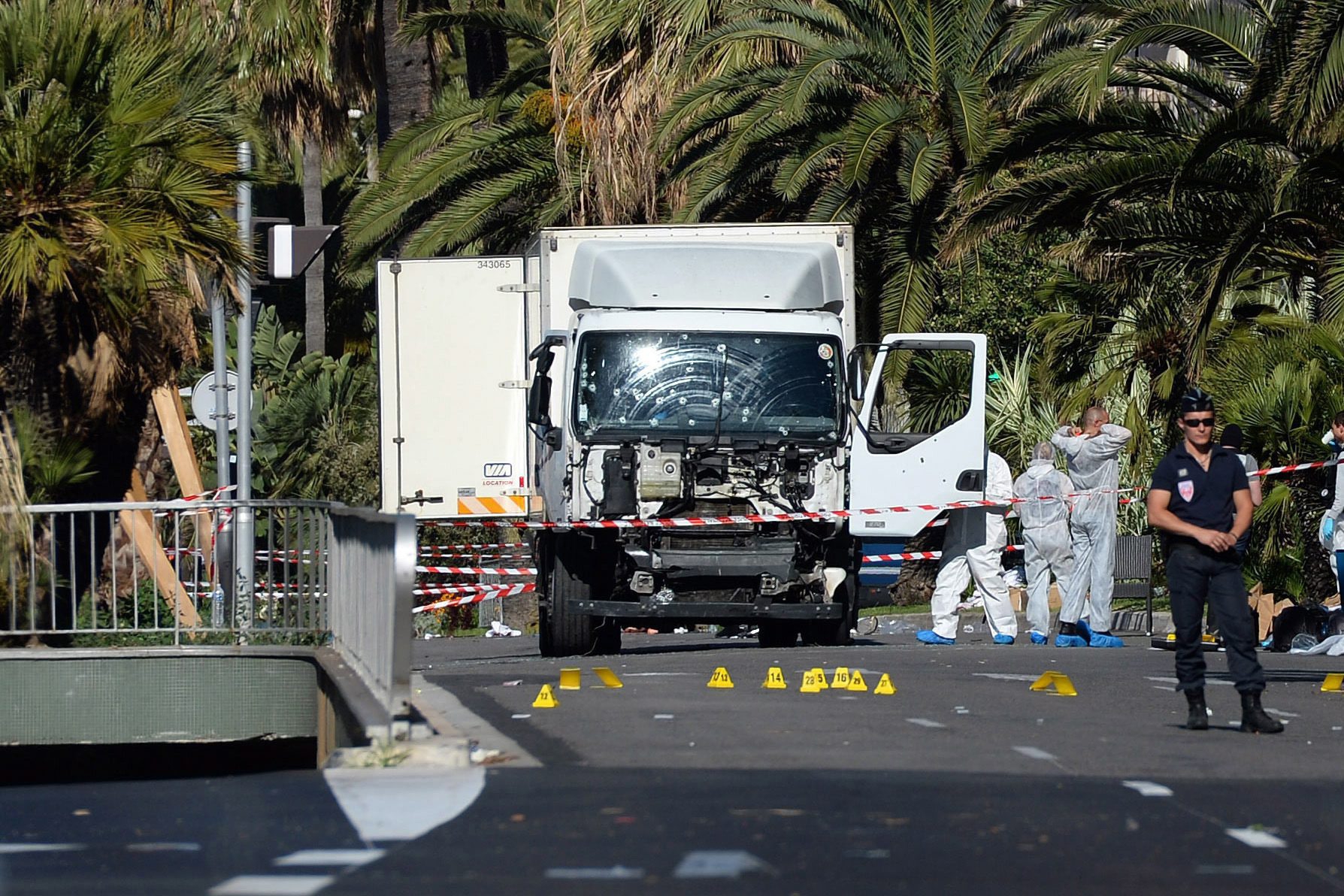 epa05426298 Police secure the area where a truck drove into a crowd during Bastille Day celebrations in Nice, France, 15 July 2016. According to reports, at least 84 people died and many were injured after a truck drove into the crowd on the famous Promenade des Anglais during celebrations of Bastille Day in Nice, late 14 July. Anti-terrorism police took over the investigation in the incident, media added.  EPA/ANDREAS GEBERT FRANCE NICE TRUCK ATTACK