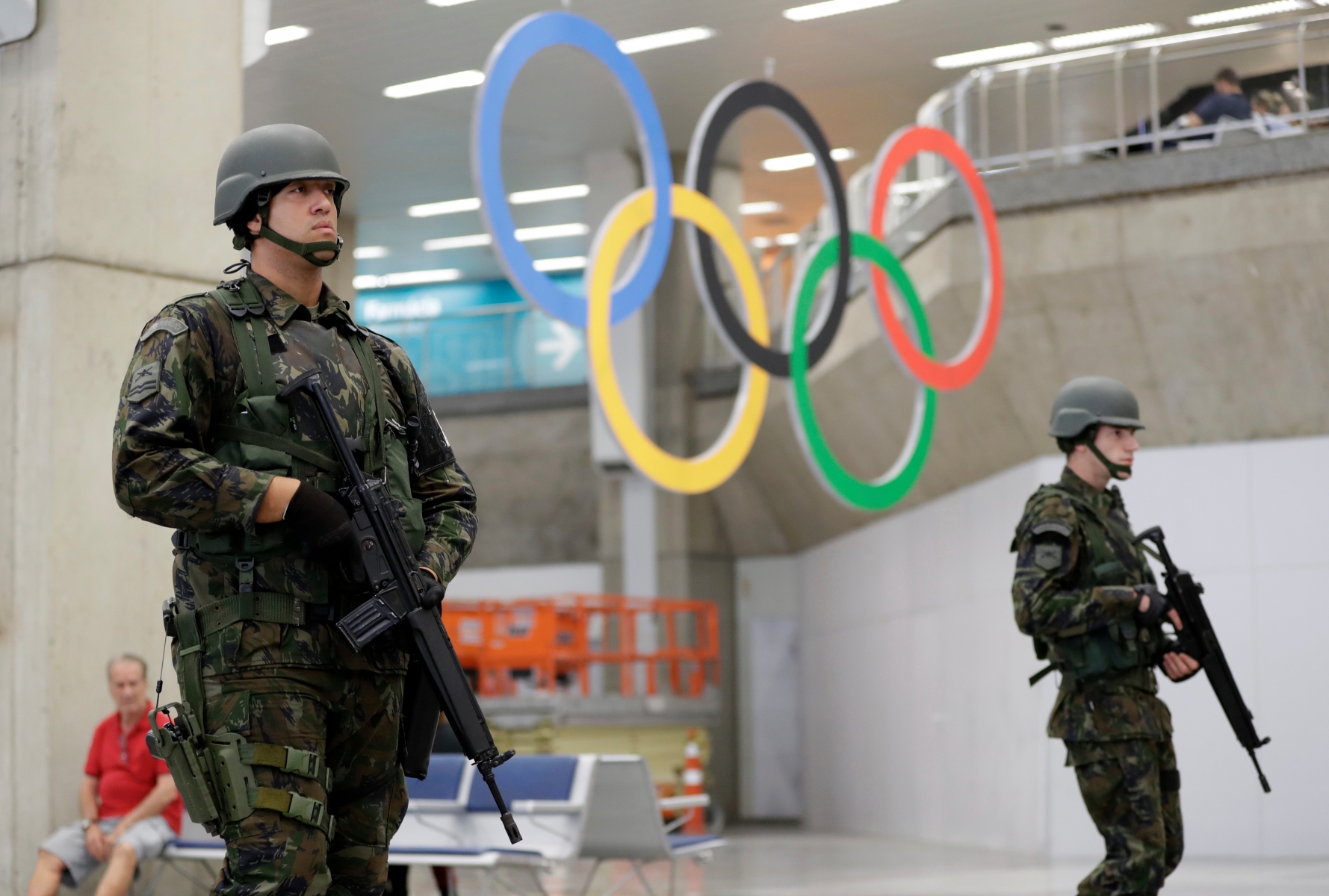 Brazilian soldiers patrol in the Rio de Janeiro International Airport ahead of the 2016 Summer Olympics in Rio de Janeiro, Brazil, Tuesday, Aug. 2, 2016. The Olympics is scheduled to open Aug. 5. (AP Photo/Gregory Bull) Rio Olympics