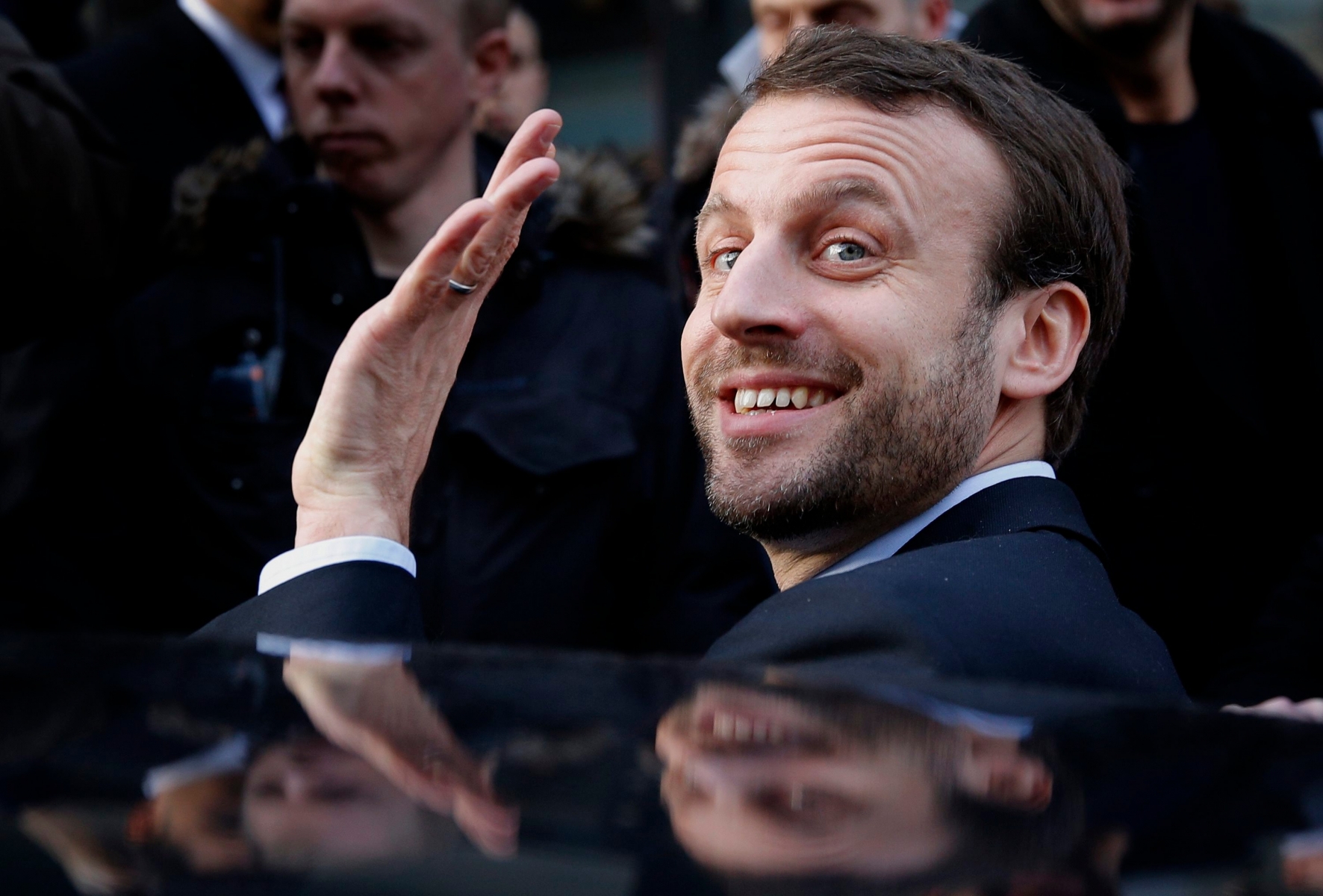FILE - In this Jan.6, 2016 file photo, French Economy Minister Emmanuel Macron waves as he leaves after a visit to a shopping center. Macron, an outspoken former investment banker who has encouraged start-ups and more labor flexibility, has quit the socialist government Tuesday Aug. 30, 2016 amid speculation that he is considering a presidential bid. (AP Photo/Christophe Ena; File) France Presidential Elections