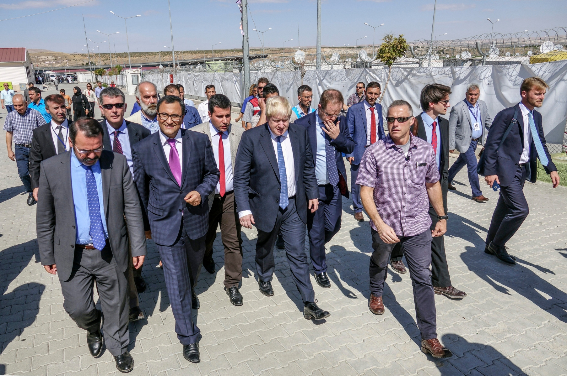British Foreign Secretary Boris Johnson, center, is surrounded by Turkish officials during his visit to the Syrian refugee camp in Nizip in Gaziantep province, Turkey, Monday, Sept. 26, 2016. Johnson is on a three-day visit to Turkey.(Ali Ihsan Ozturk/Anadolu Agency Pool via AP ) Turkey Britain