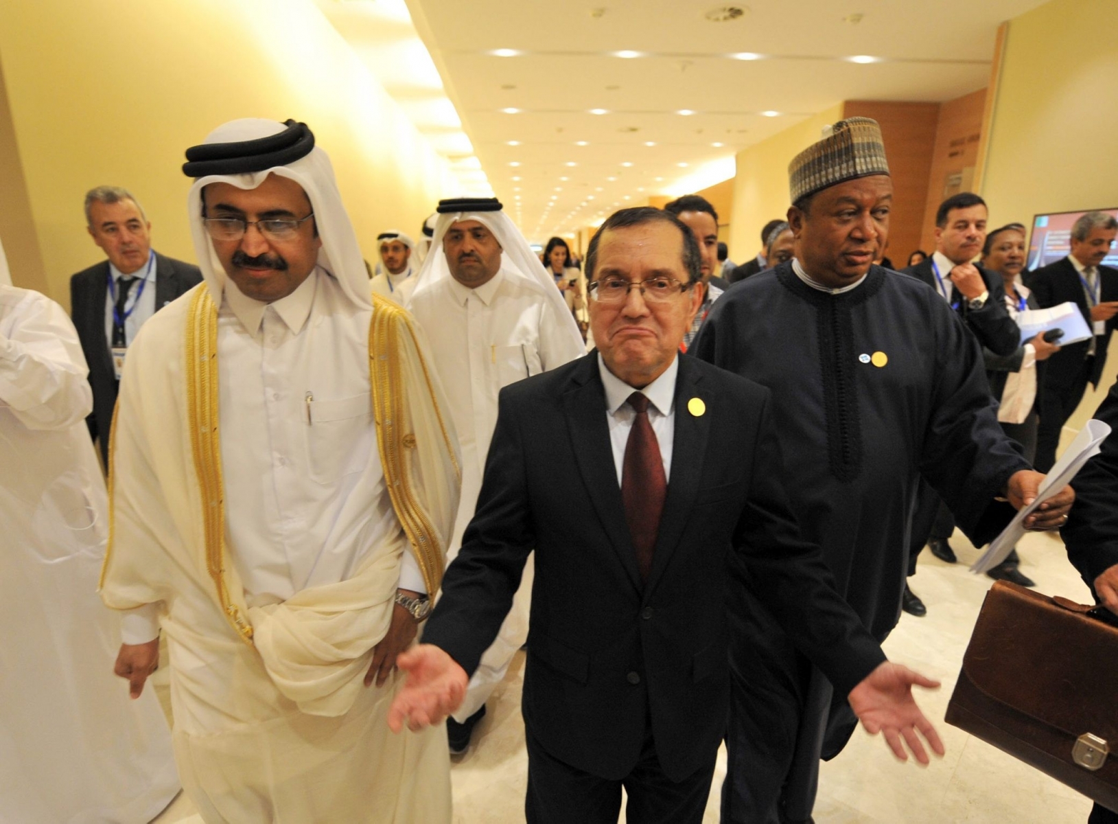 Is this photo dated Wednesday, Sept. 28, 2016, Algerian Energy Minister Noureddine Boutarfa, center, Bin Saleh Al-Sada, Minister of Energy and Industry of Qatar, left, and acting Secretary General of OPEC Mohammed Barkindo, right, leave the  International Conference Center after a  meeting of oil ministers of the Organization of the Petroleum Exporting countries, OPEC, in Algiers, Algeria. OPEC nations reached a preliminary agreement Wednesday to curb oil production for the first time since the global financial crisis eight years ago, in an effort to reduce a global glut of crude that has depressed oil prices for more than two years and weakened the economies of oil-producing nations. (AP Photo/Sidali Djarboub) APTOPIX Algeria Oil Prices