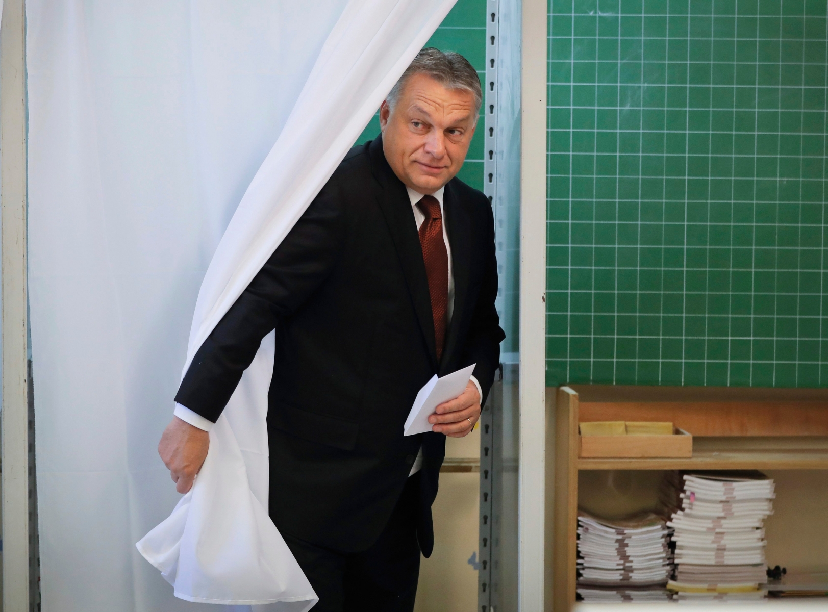 Hungarian Prime Minister Viktor Orban exits a voting cabin after voting in the referendum in Budapest, Hungary, Sunday, Oct. 2, 2016. Hungarians vote in a referendum which Orban hopes will give his government the popular support it seeks to oppose any future plans by the European Union to resettle asylum seekers among its member states. (AP Photo/Vadim Ghirda) Hungary Referendum