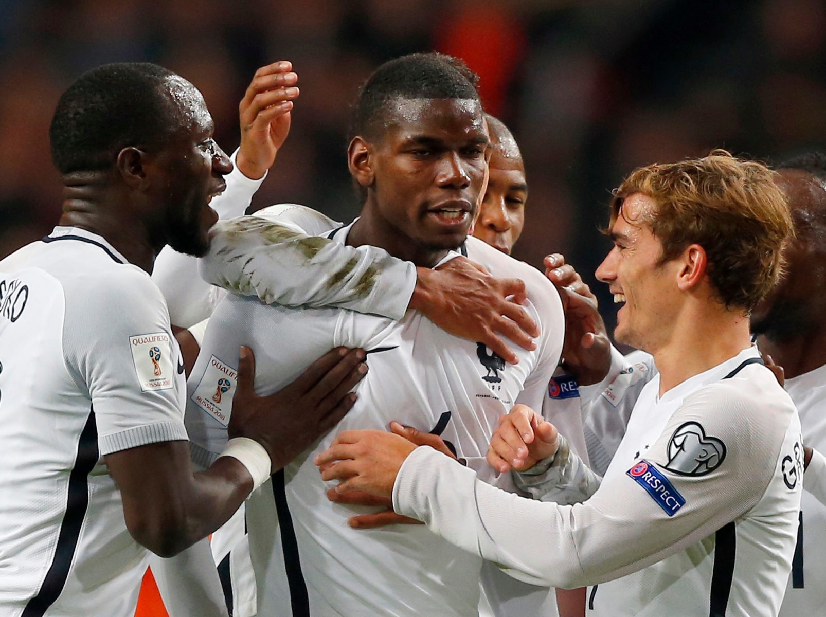 France's Paul Pogba, center, is congratulated by teammates after scoring the opening goal during the World Cup Group A qualifying soccer match in the ArenA stadium in Amsterdam, Netherlands, Monday, Oct. 10, 2016. (AP Photo/Peter Dejong)  Soccer WCup 2018 Netherlands France