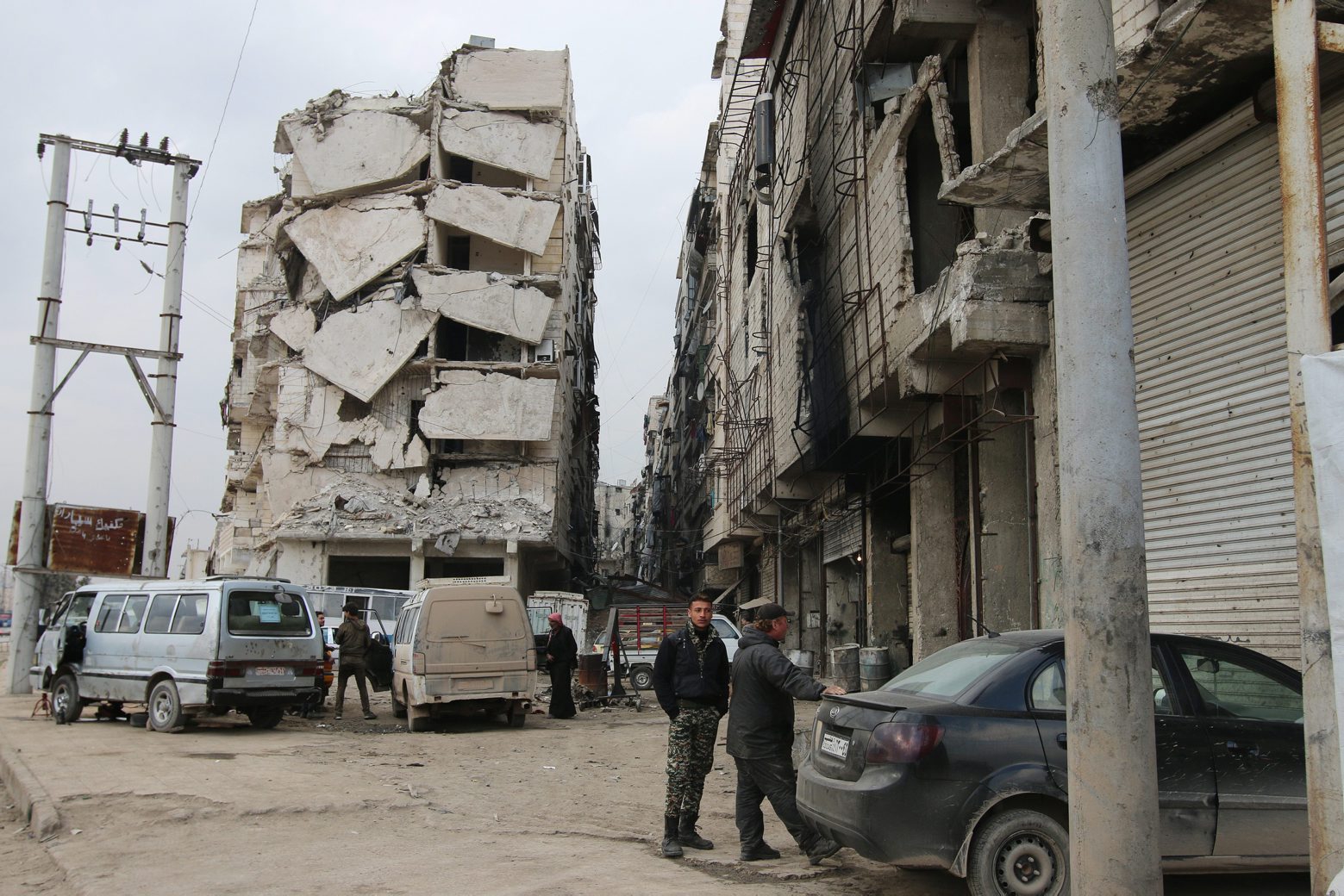 In this Thursday, Feb. 11, 2016 photo, a building is seen with heavy damage in Aleppo, Syria. The fighting around Syria's largest city of Aleppo has brought government forces closer to the Turkish border than at any point in recent years, routing rebels from key areas and creating a humanitarian disaster as tens of thousands of people flee. (Alexander Kots/Komsomolskaya Pravda via AP) Mideast Syria