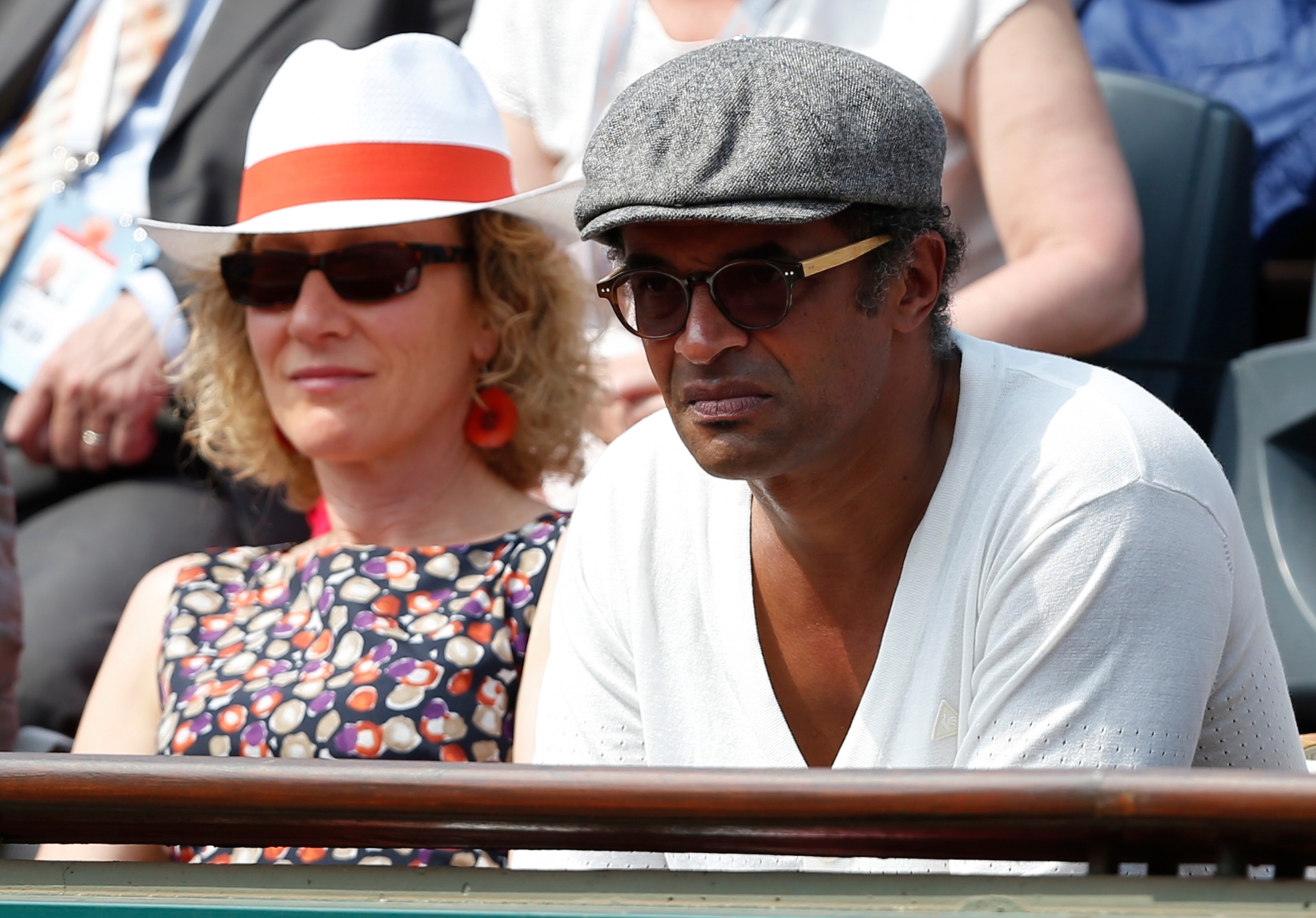 Former Roland Garros winner and musician Yannick Noah watches Russia's Maria Sharapova defeat Serbia's Jelena Jankovic in three sets 0-6, 6-4, 6-3, in their quarterfinal match at the French Open tennis tournament, at Roland Garros stadium in Paris, Wednesday June 5, 2013. (AP Photo/Petr David Josek)d TENNIS FRENCH OPEN 2013